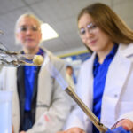 Girls performing chemistry experiment